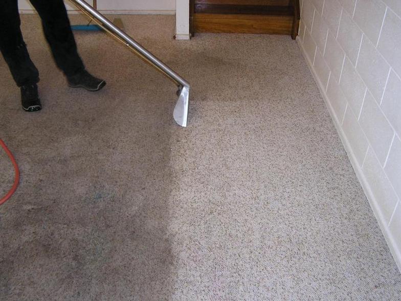 Man vacuuming carpet